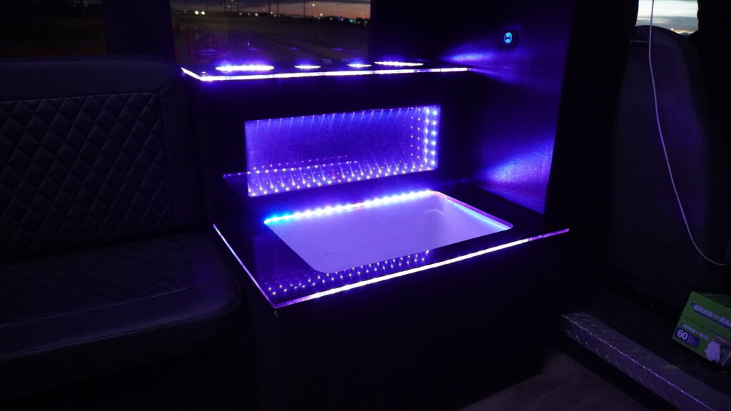Party Bus Interior Cooler Luxury interior of a Calgary party bus with LED lighting and premium seating. With a Cooler for drinks